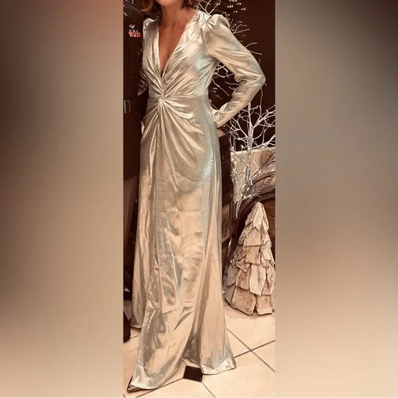 This is a Reformation Gatsby Dress in a silver or champagne color new with tags